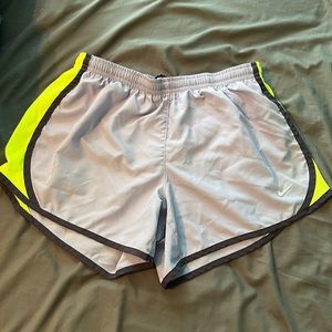 Purple and neon yellow Nike shorts. Kids large